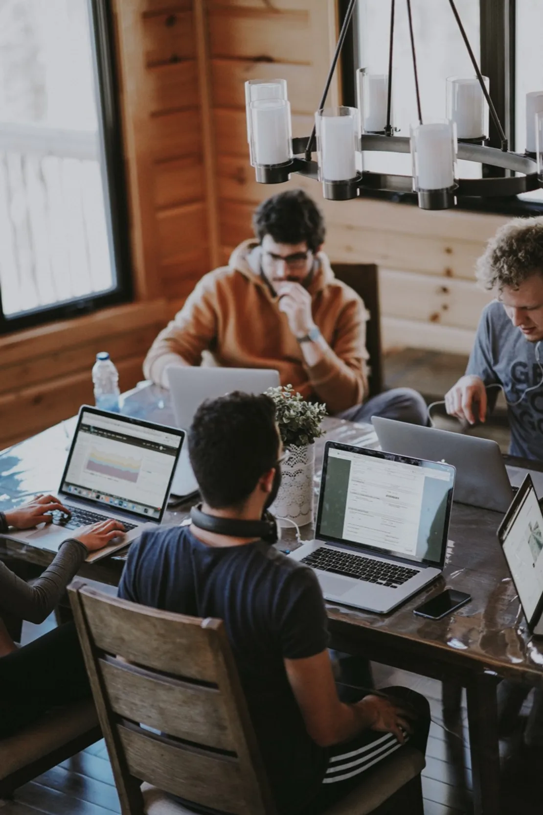 Startup team collaborating around a shared screen